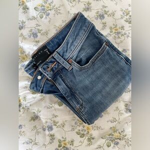 ASOS DESIGN Petite High Rise Y2K Stretch Flare Jeans in Vintage Mid Wash